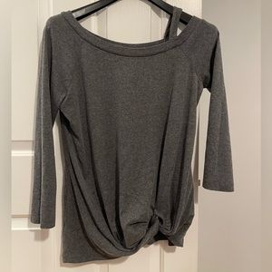 NWOT. Women’s T-shirt With shoulder cut out and knot. 3/4 sleeves. Never worn.